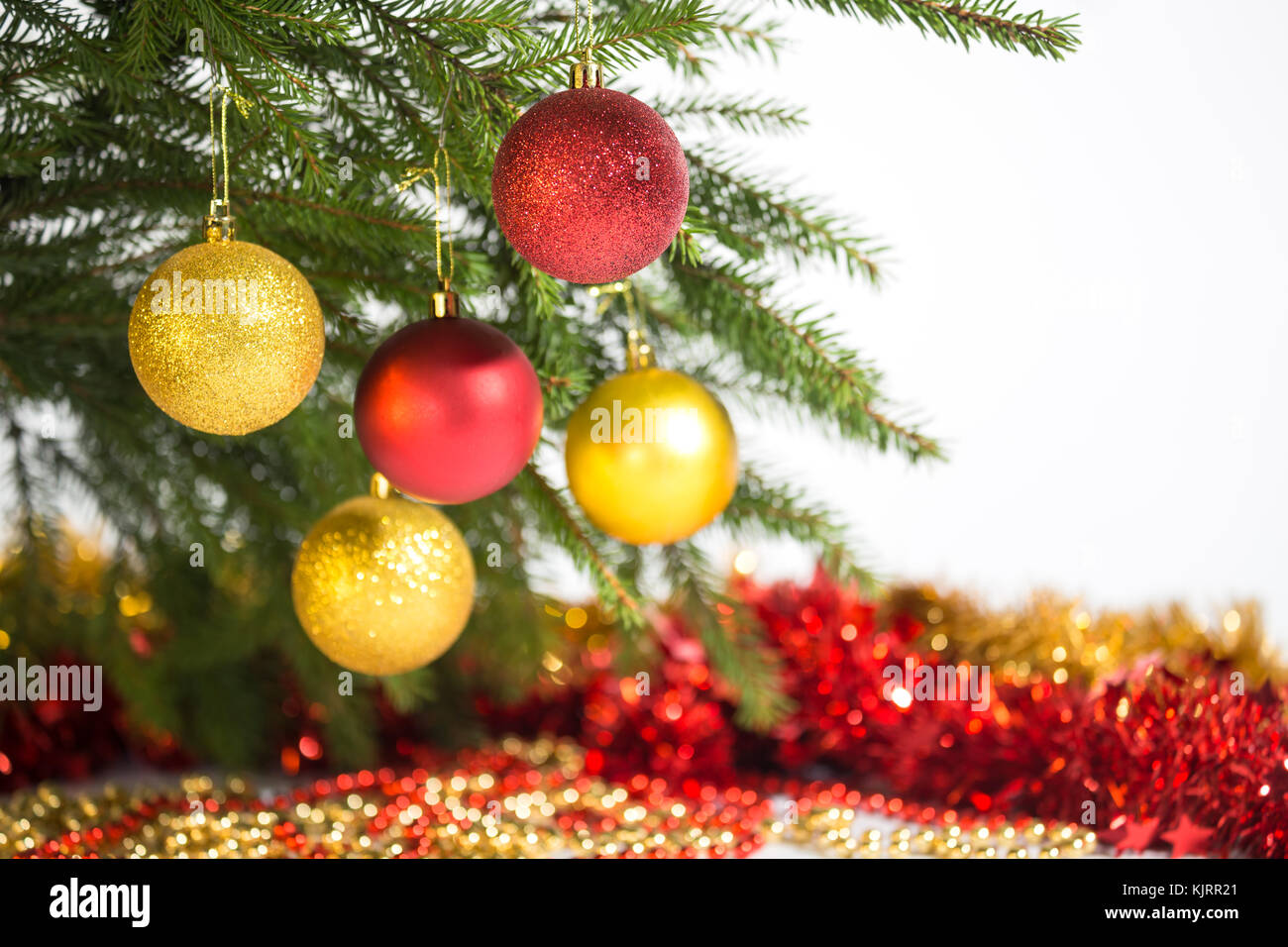 Christmas decorations, five golden and red balls hanging on the ...