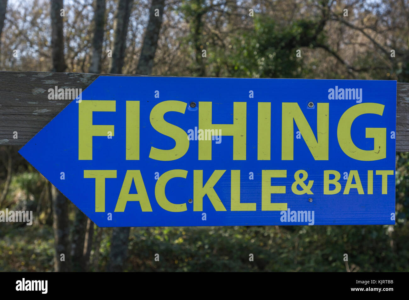 Sign pointing to a Fishing tackle and bait shop / supplier. In the