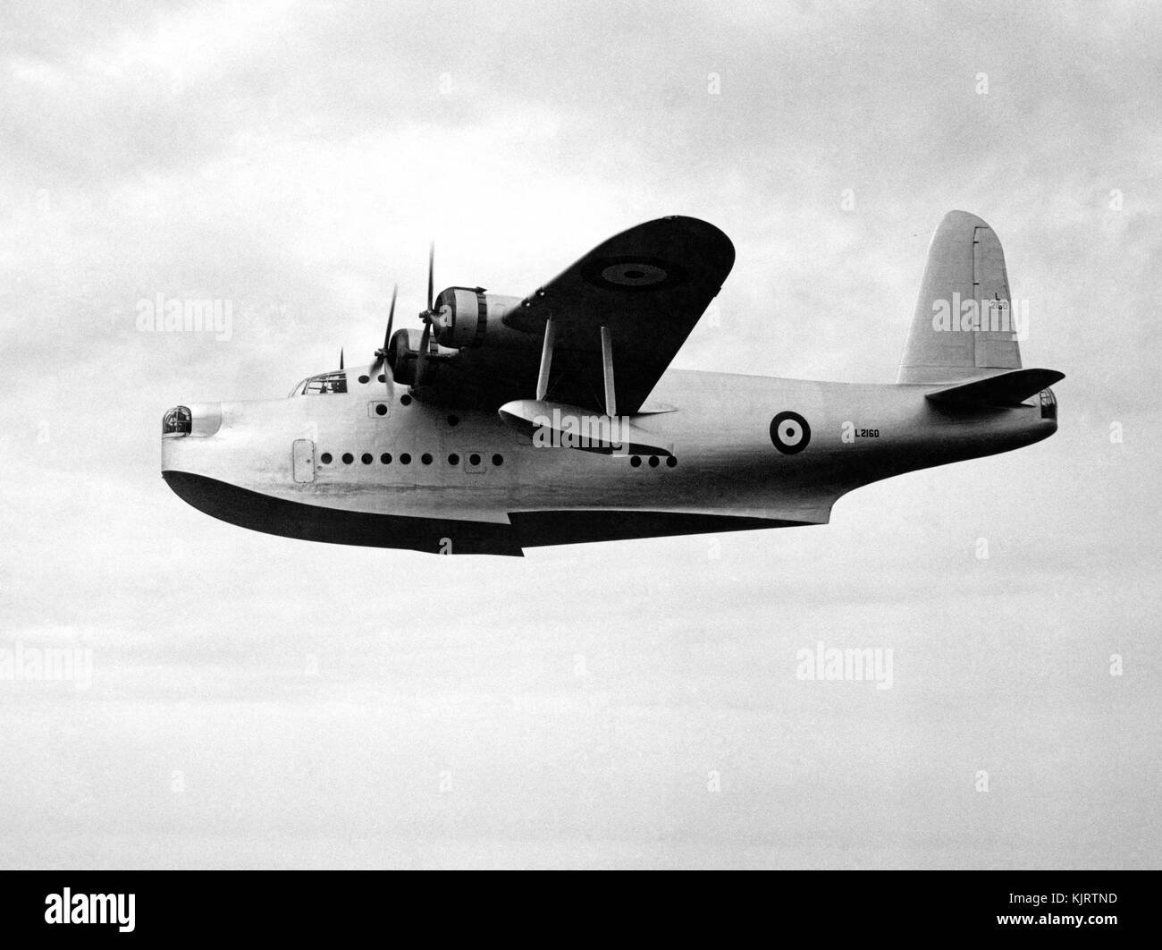 Sunderland Flying boat prototype flying over a river inlet. Coastal Command. WW2 Stock Photo