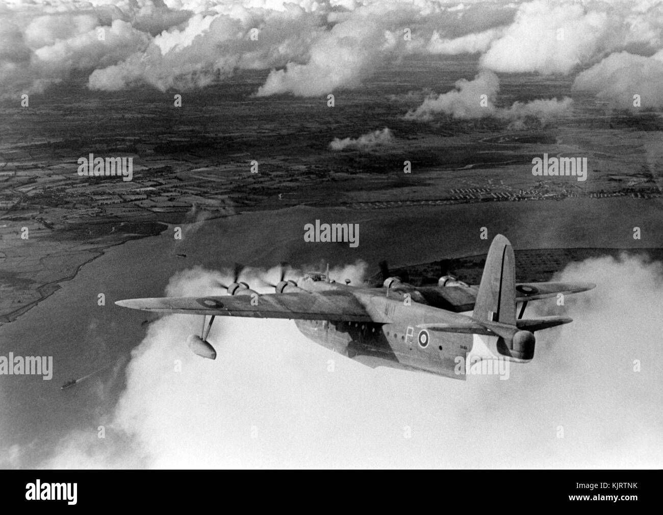 Sunderland Flying boat prototype flying over a river inlet. Coastal Command. WW2 Stock Photo