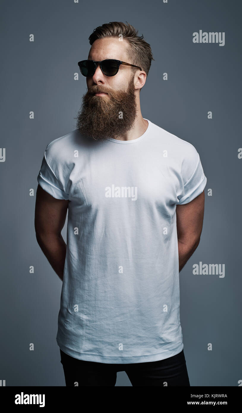 Stylish Young Man With A Long Beard Wearing A White T Shirt And