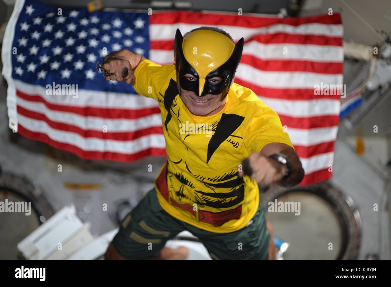 NASA Expedition 53 prime crew member American astronaut Mark Vande Hei  wears a Wolverine costume while celebrating Halloween aboard the  International Space Station October 31, 2017 in Earth orbit. (photo by NASA
