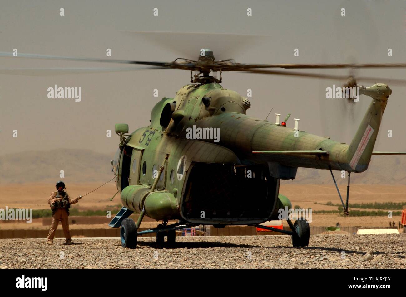 An Afghan National Army MI-17 helicopter waits to pick up soldiers during a battlefield circulation June 22, 2010 in the Uruzgan province, Afghanistan.  (photo by Kenny Holston via Planetpix) Stock Photo