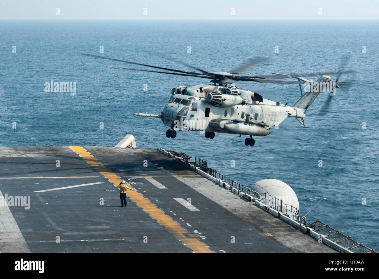 A U.S. Marine Corps CH-53E Super Stallion helicopter lands on the flight deck aboard the U.S. Navy America-class amphibious assault ship USS America November 20, 2017 in the Arabian Gulf. (photo by Vance Hand via Planetpix) Stock Photo
