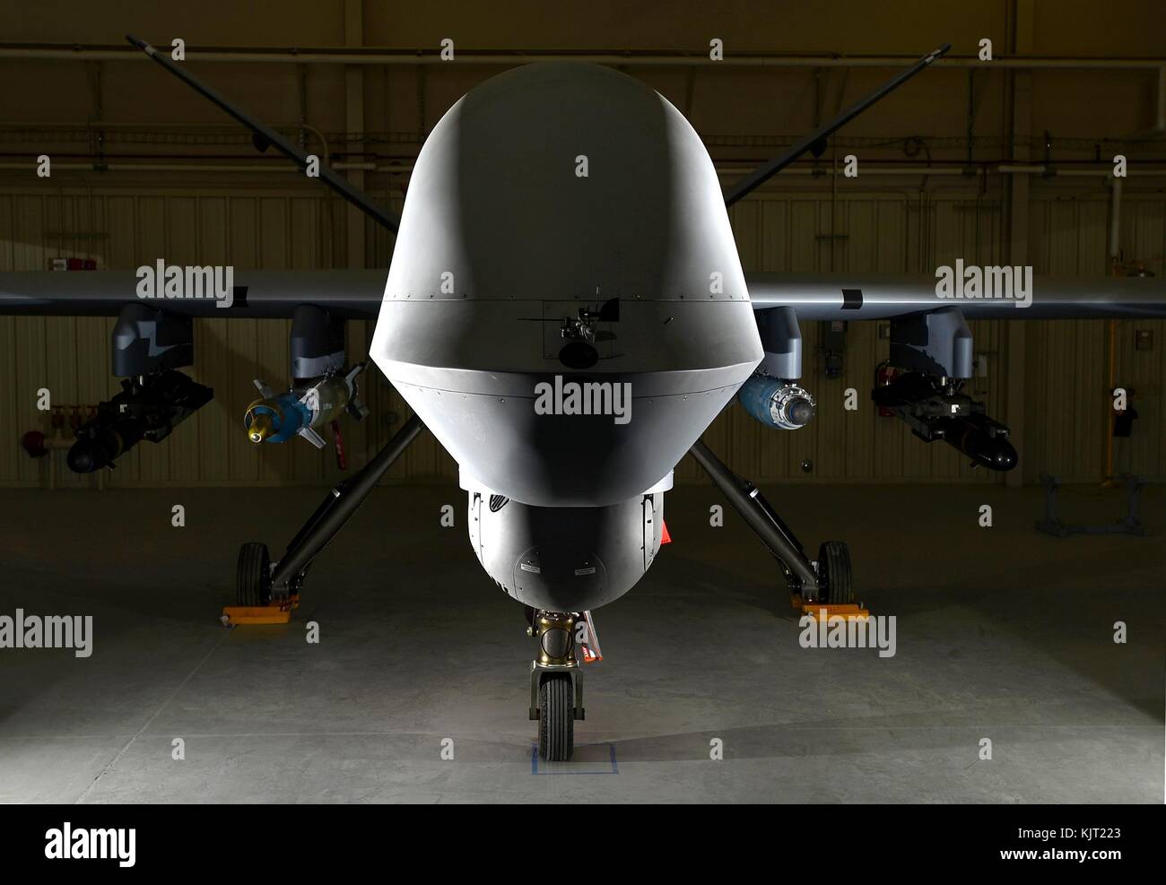 A U.S. Air Force MQ-9 Reaper Predator B unmanned aerial vehicle loaded with AGM-114 Hellfire missiles, a GBU-12 Paveway II laser-guided bomb, and a GBU-38 joint direct attack munition sits in the hanger at the Creech Air Force Base April 13, 2017 in Indian Springs, Nevada. (photo by Christian Clausen via Planetpix) Stock Photo