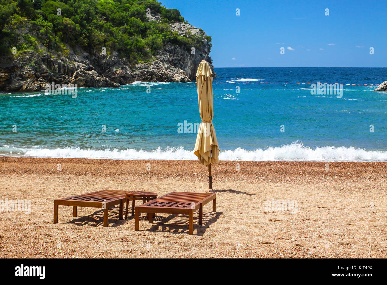 Empty beach with two chairs, Famous Queen's Beach (Kraljicina Plaza), Milocer, Montenegro Stock Photo