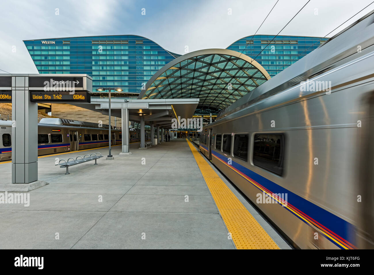 Train approaching Denver International Airport Train Station and Westin