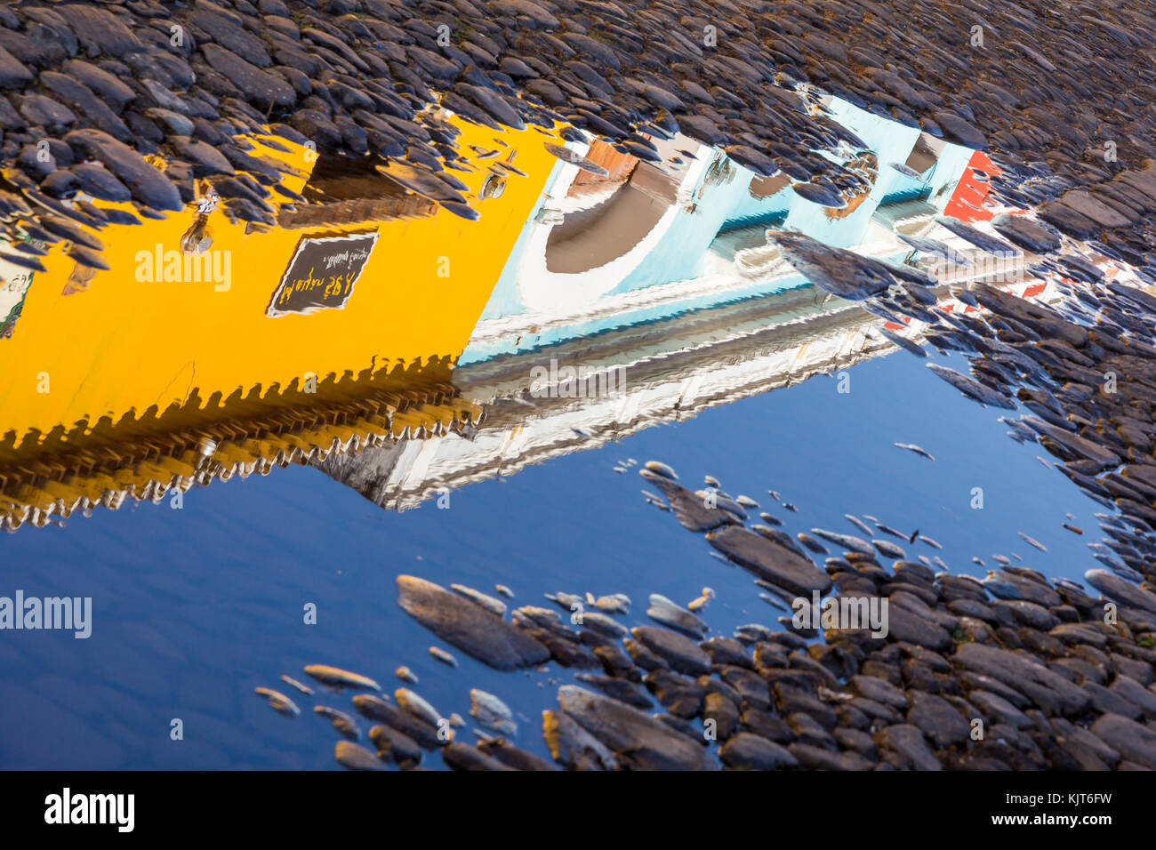 Reflections of colonial houses in a puddle | Antigua | Guatemala Stock ...