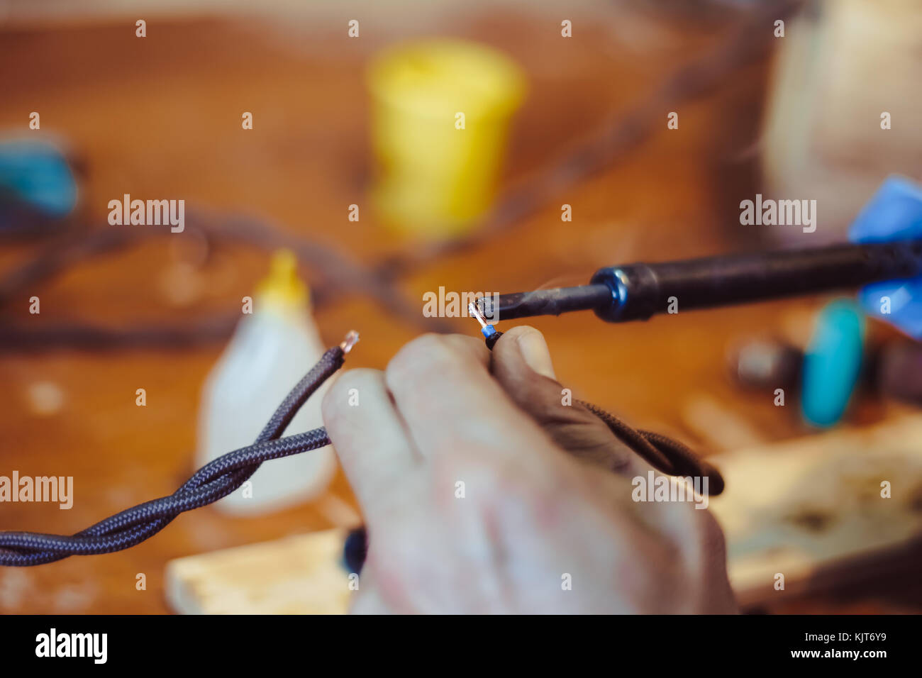 melting solder wire on soldering iron tip Stock Photo Alamy