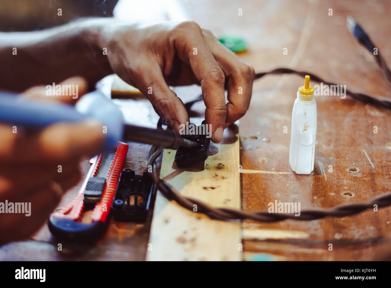 melting solder wire on soldering iron tip Stock Photo Alamy