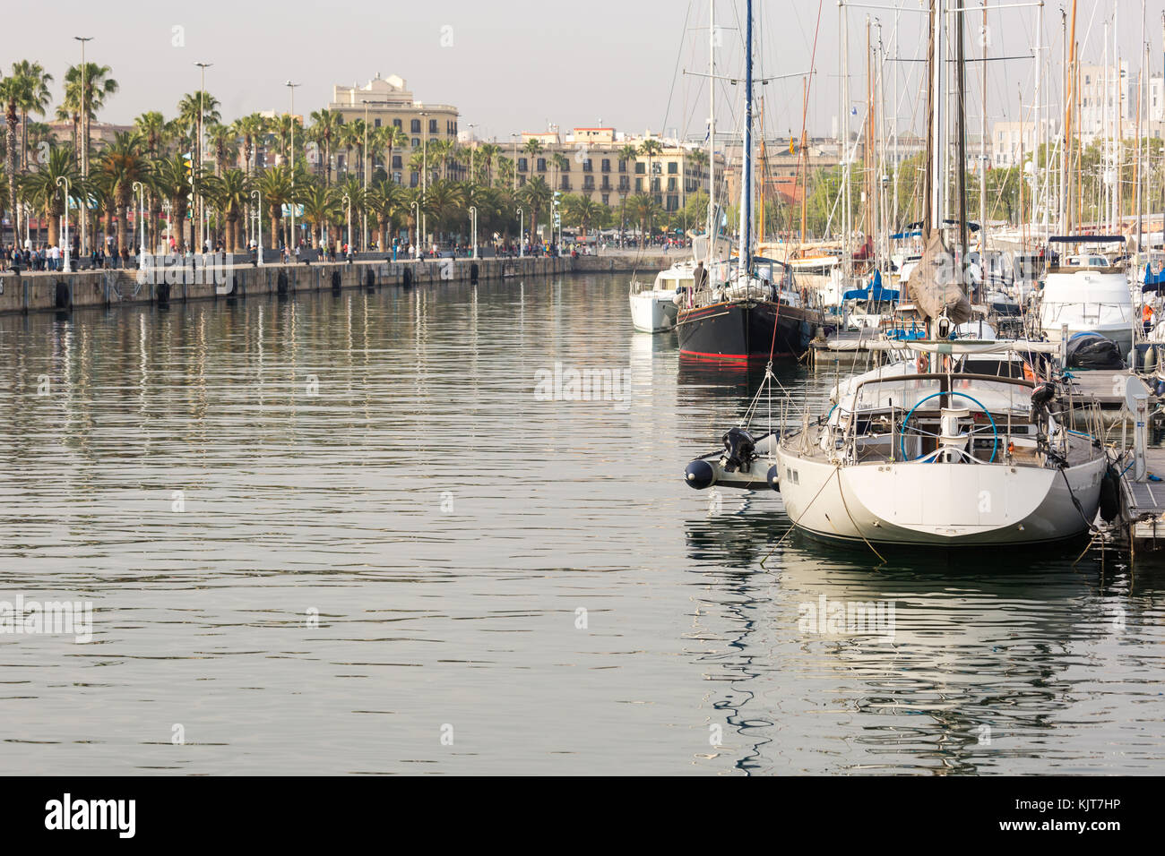 Waterfront with boardwalk and sailboats at Port Vell, the old marina of Barcelona, Spain Stock Photo
