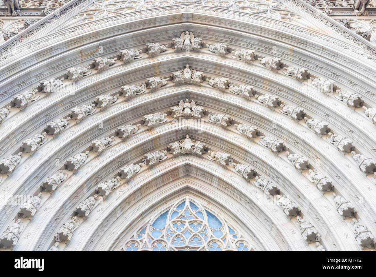 Ornate archivolt at the entrance of the cathedral in Barcelona, Spain Stock Photo