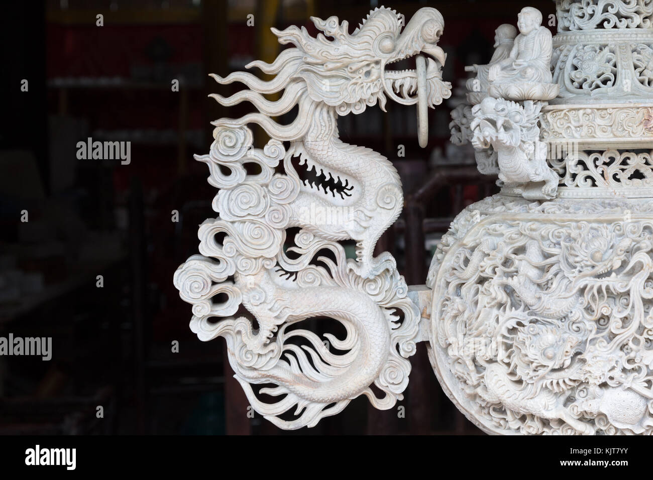 Detail of an ornate handle in the shape of a dragon on an asian vase in Sapa, Vietnam Stock Photo