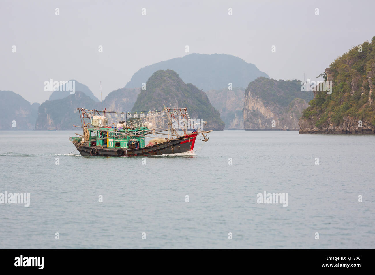 A small local fisher boat in Halong Bay, Vietnam Stock Photo