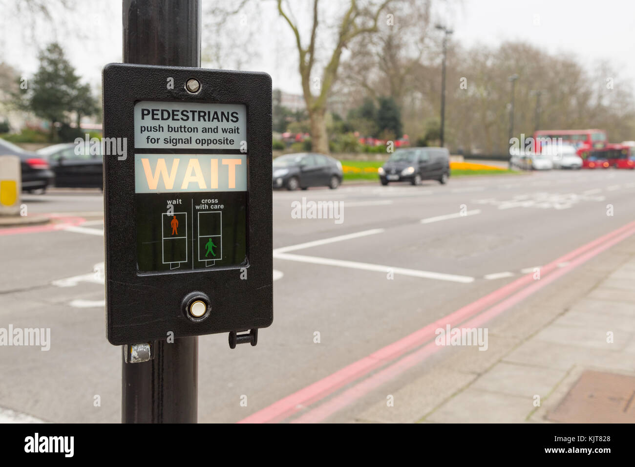 Pedestrian button for signal indicating wait in London, UK, near Hyde park Stock Photo