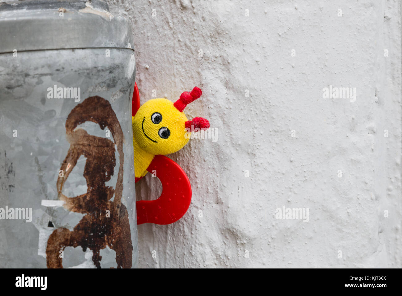 Baby rattle shaker stuck behind a rain pipe Stock Photo Alamy
