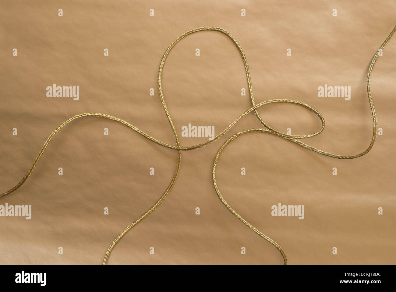 golden twine on golden paper background Stock Photo Alamy