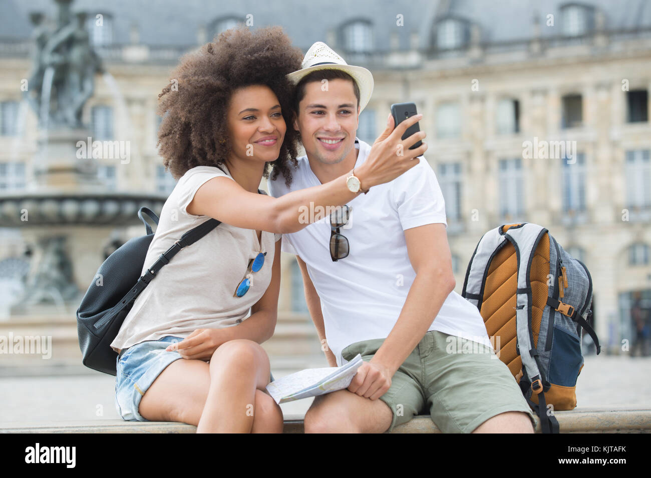 young couple taking a selfie in the city Stock Photo - Alamy