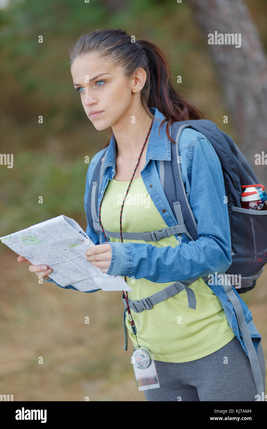 female hiker looking at map Stock Photo - Alamy