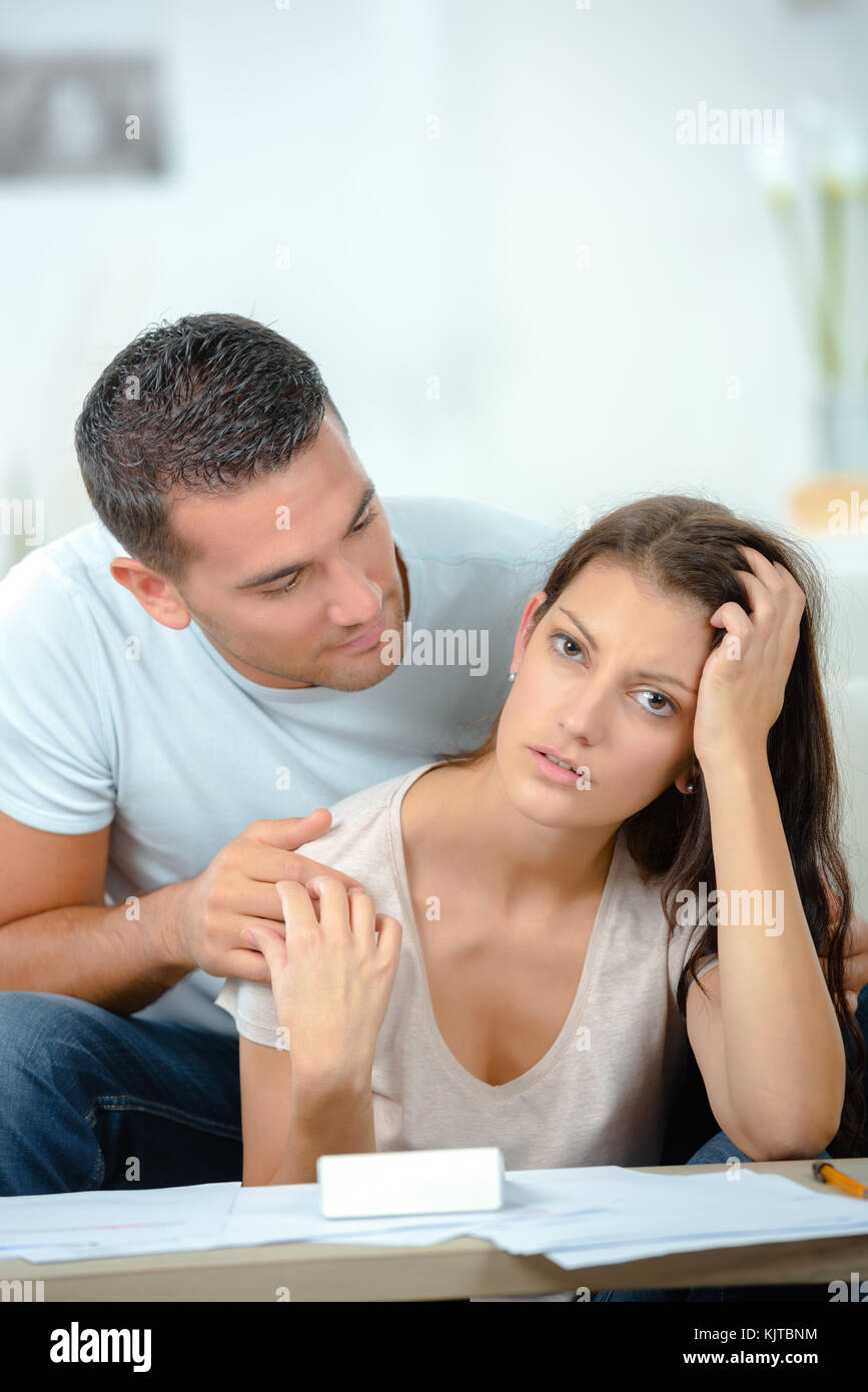 worried couple after fight sitting on sofa Stock Photo - Alamy