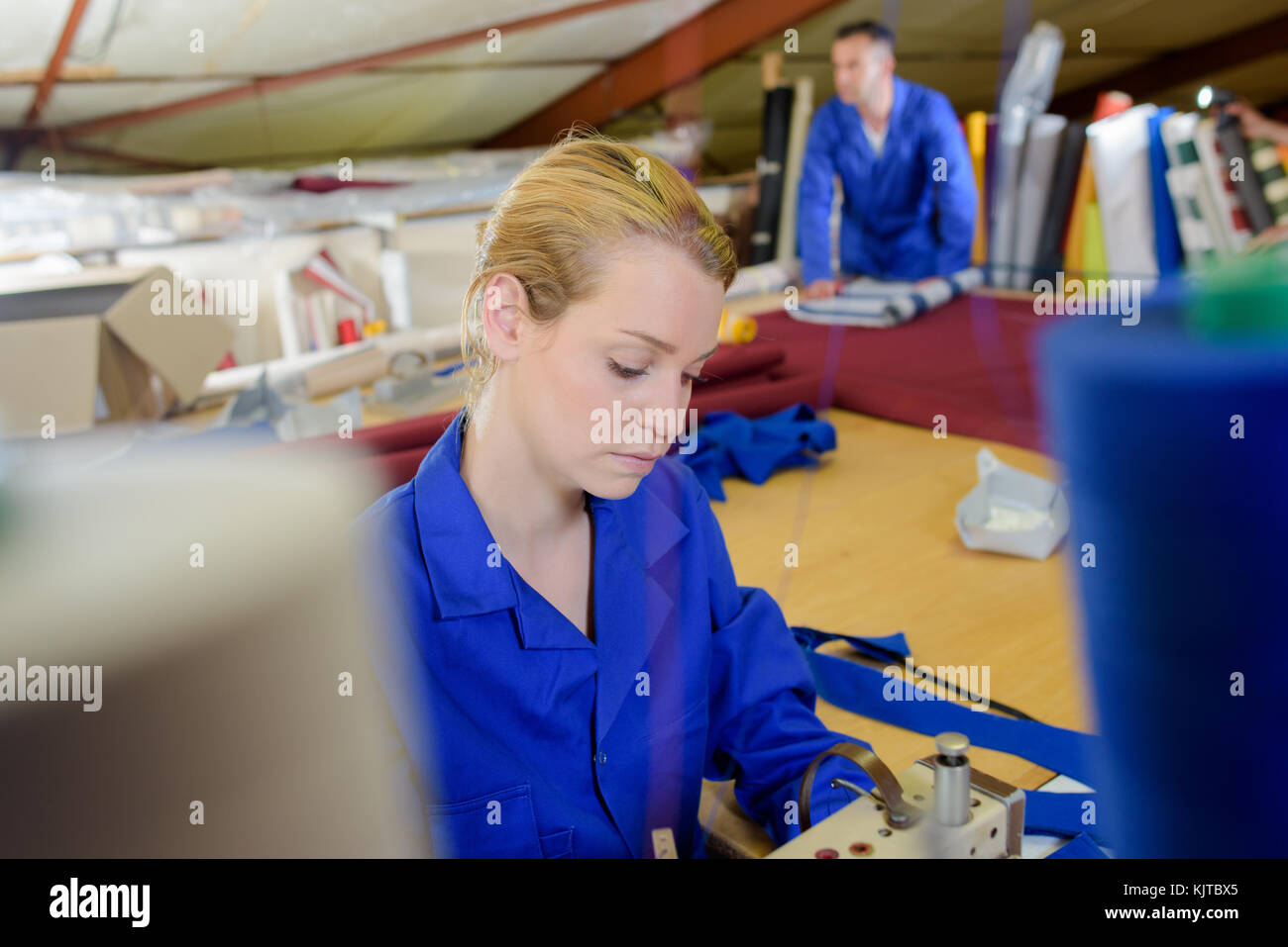 Woman using industrial sewing machine Stock Photo Alamy