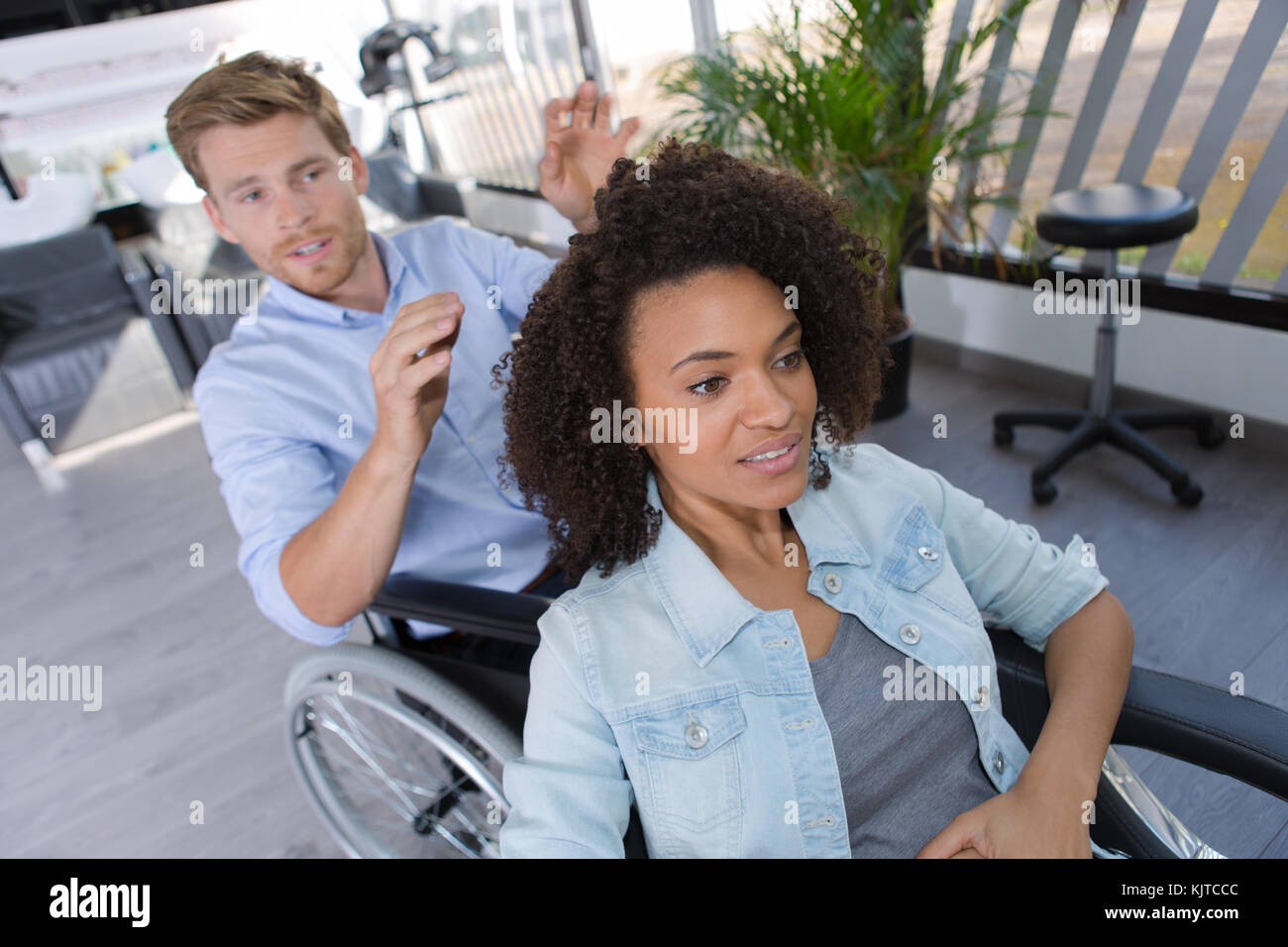handicapped hairdresser and his client Stock Photo - Alamy