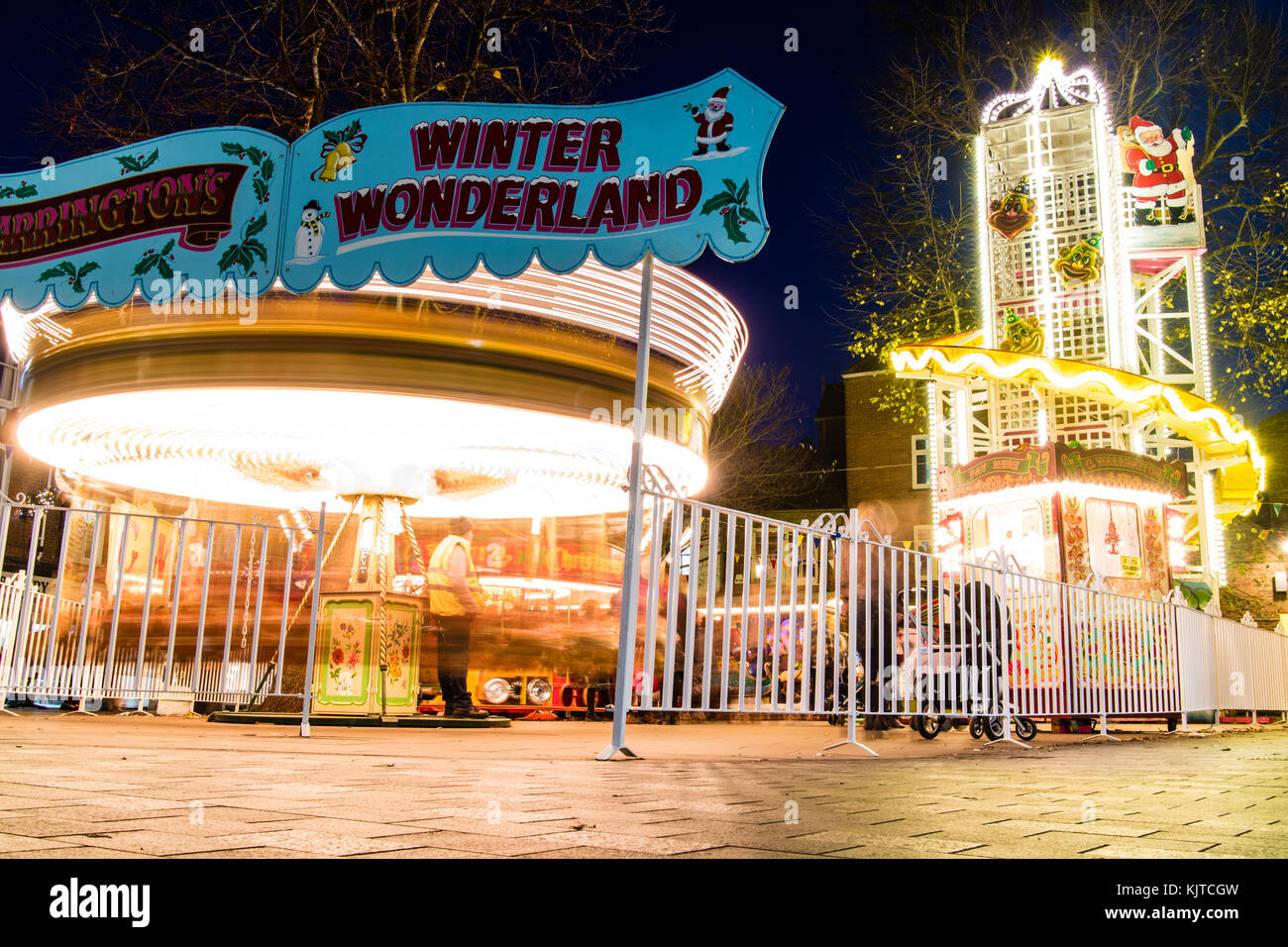 A carousel and slide, put up for Christmas in York, UK Stock Photo Alamy