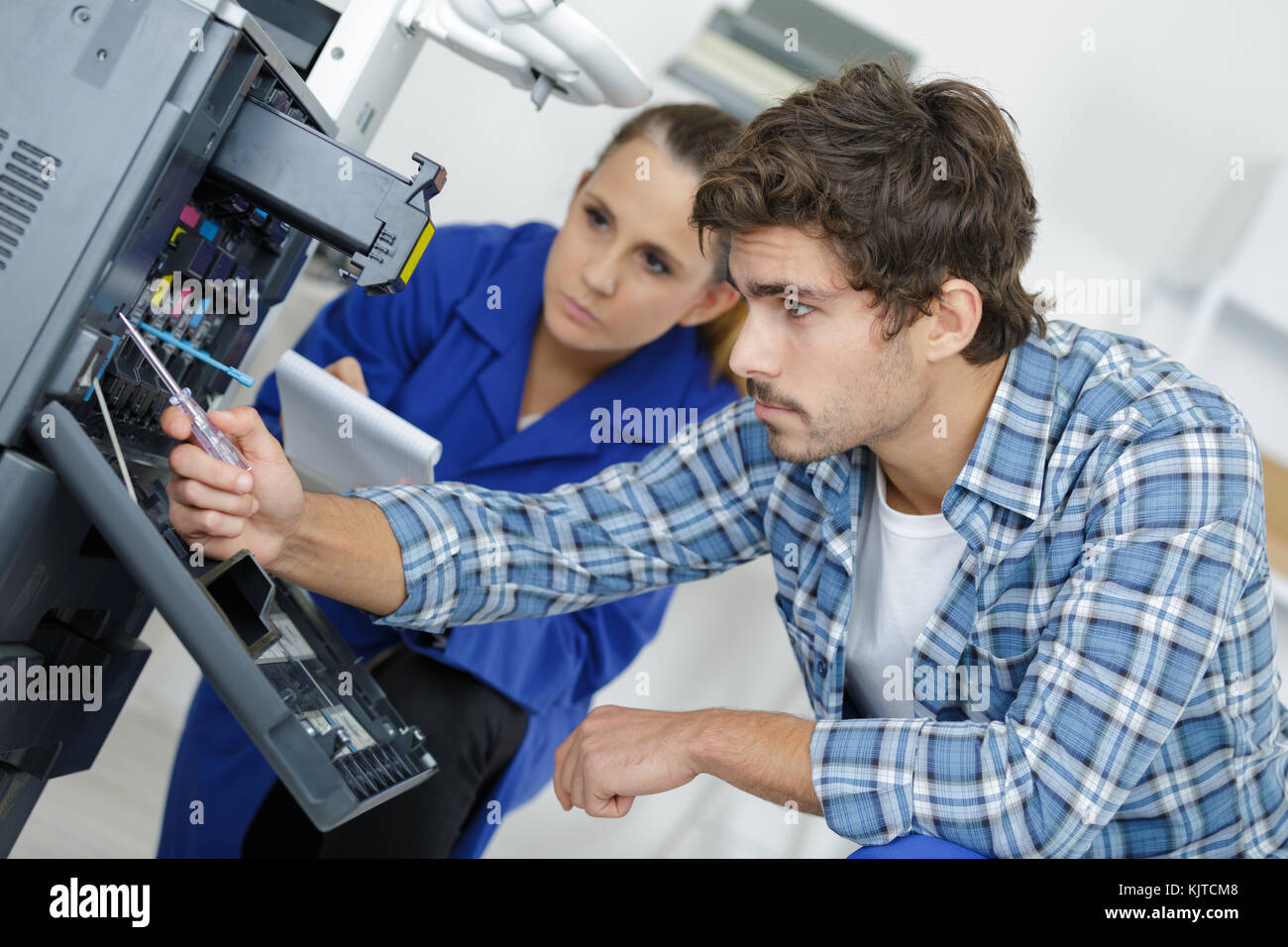 head technician inspecting the repair Stock Photo Alamy