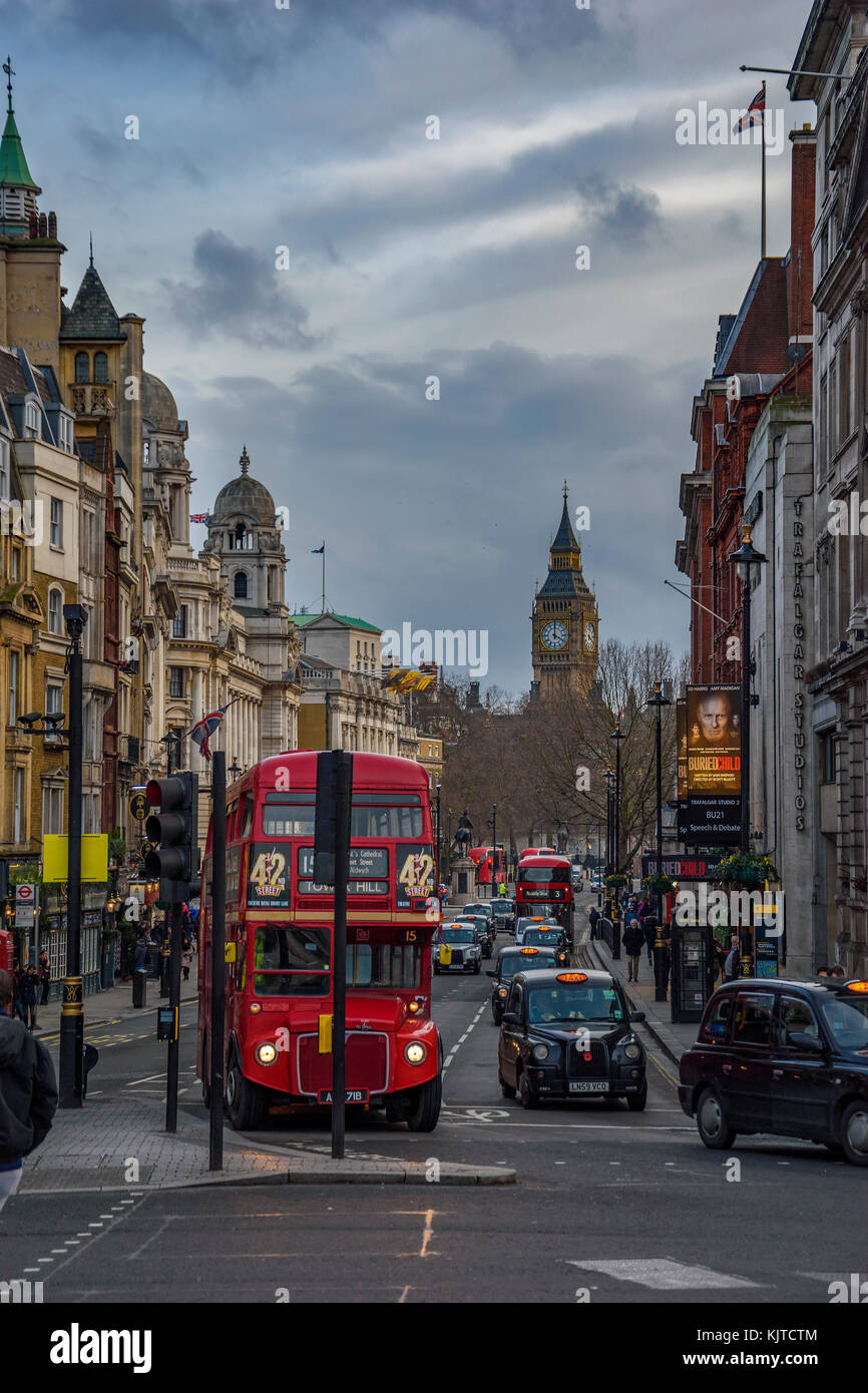 Architectural buildings and street traffic in a typical day in central London city. Urban view, centered the Famous Big Ben. London, England, UK. Stock Photo