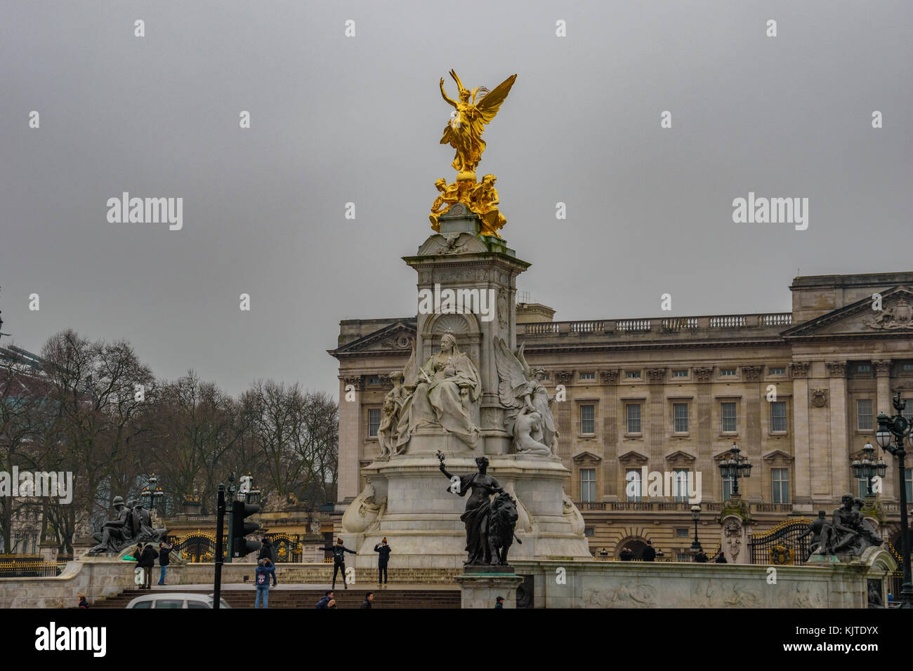 Golden statue of wisdom in front of Buckingham palace on the (Queen