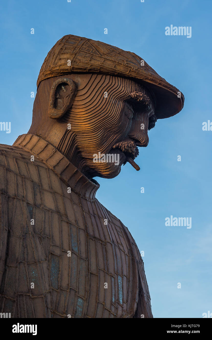 Fiddlers Green sculpture of Mariner man in North Shields against blue sky Stock Photo