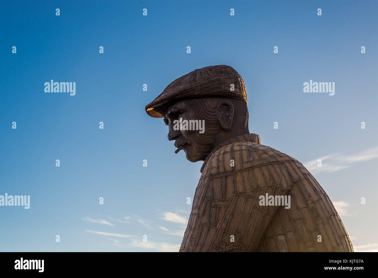 Fiddlers Green sculpture of Mariner man in North Shields against blue sky Stock Photo