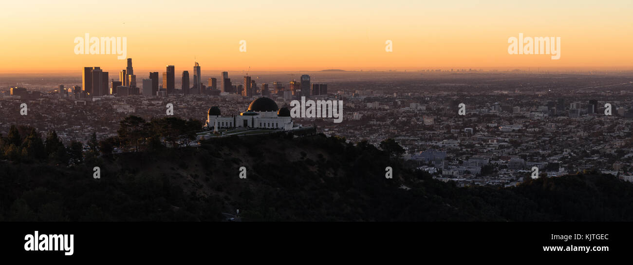 The observatory dominates the foreground with the city skyline of Los Angeles in the background Stock Photo