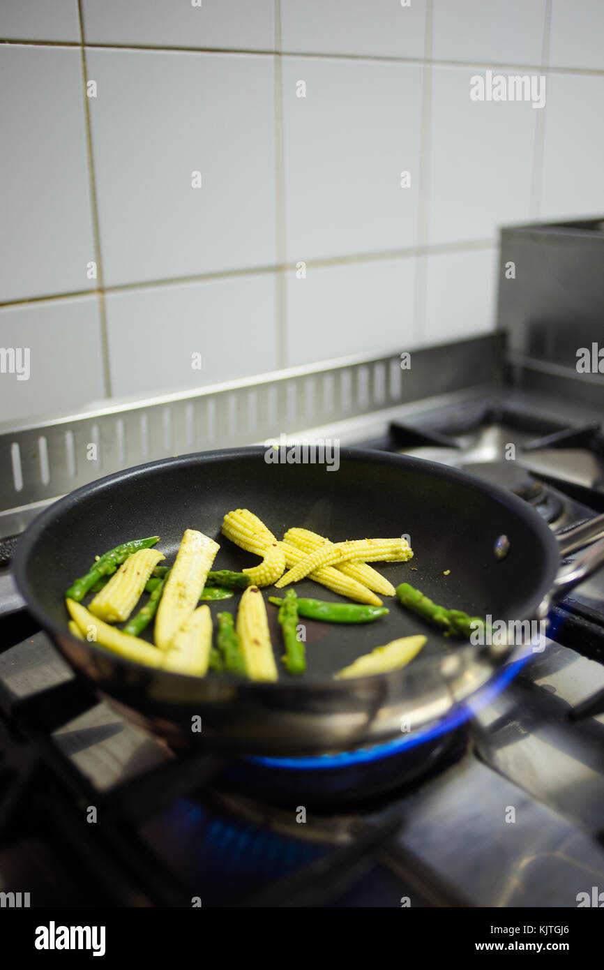 Close up view of a chef with his ingredients in a gourmet restaurant kitchen. Stock Photo