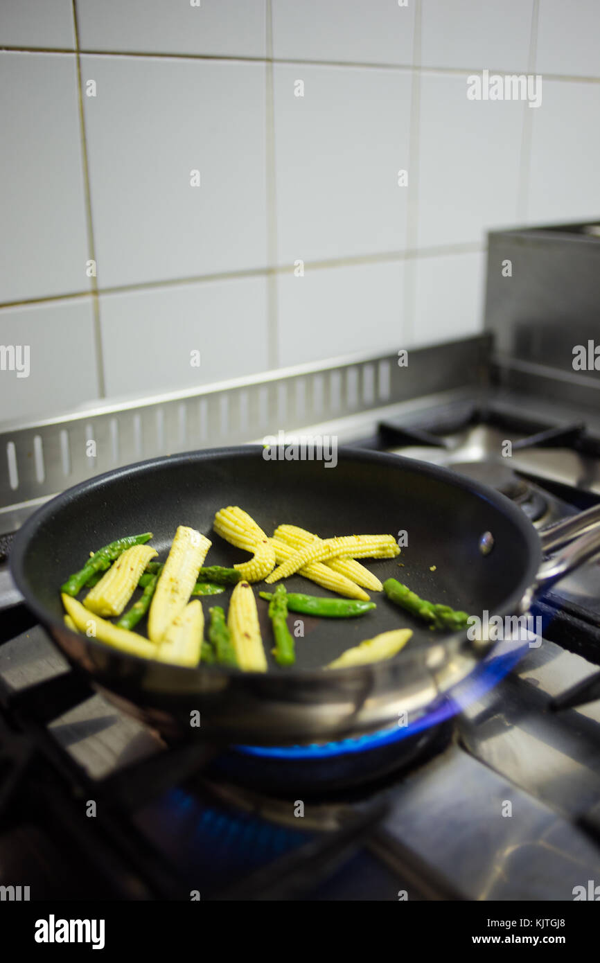 Close up view of a chef with his ingredients in a gourmet restaurant kitchen. Stock Photo