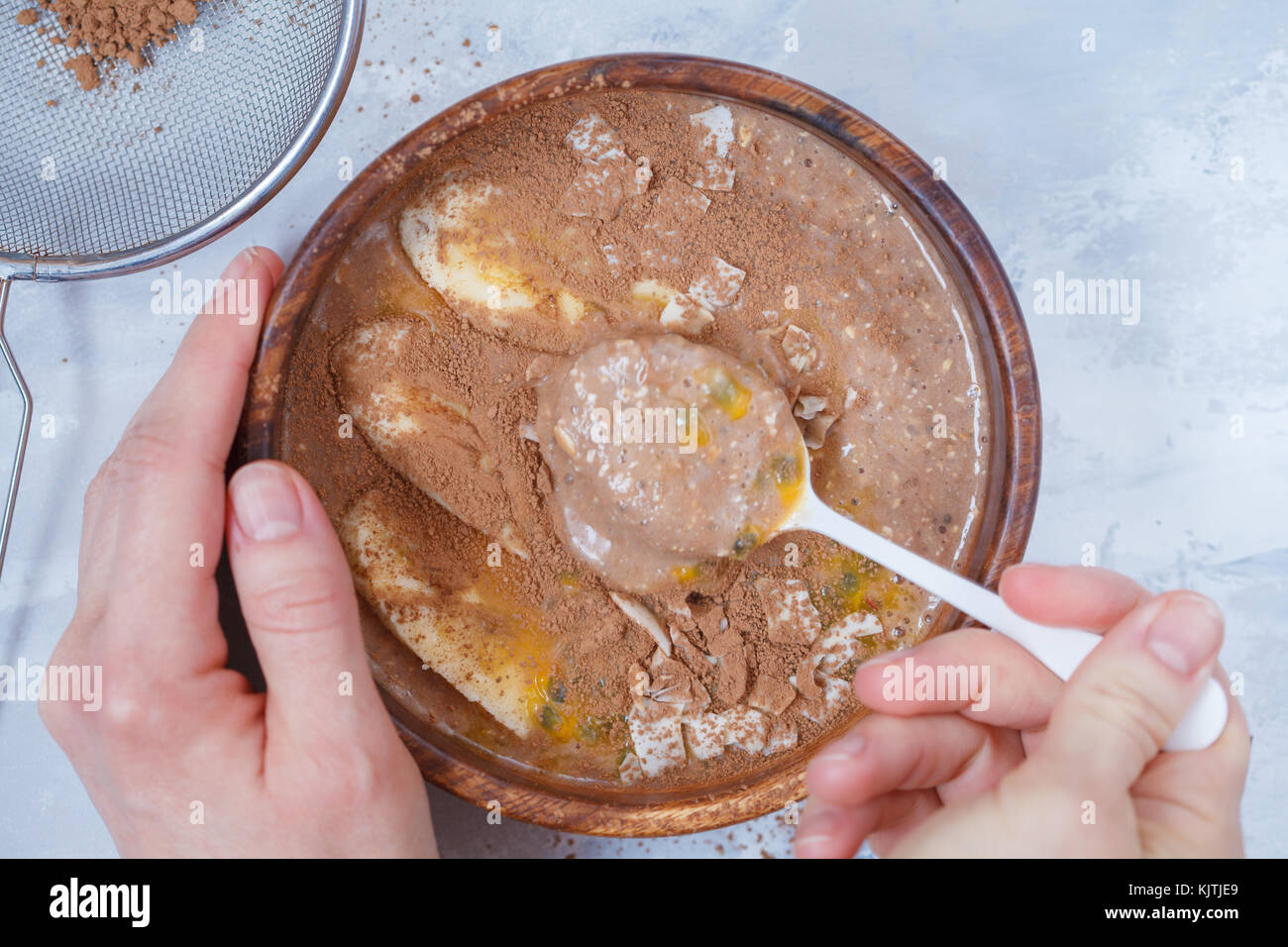 Smoothie bowl with chocolate, banana, coconut and passion fruit. Vegan