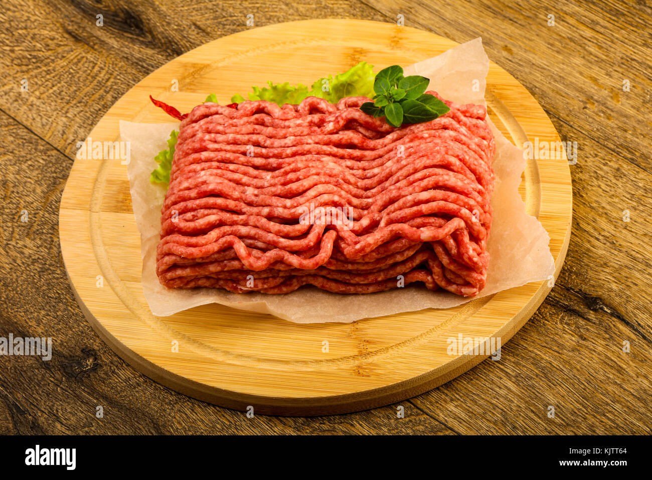 Minced beef meat with basil leaves ready for cooking Stock Photo Alamy