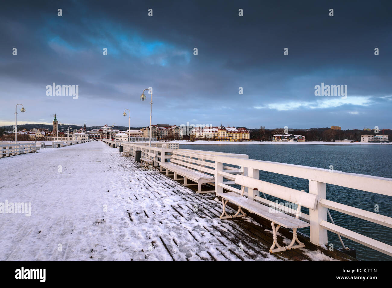 Early morning at snow covered pier in Sopot. Winter landscape. Poland. Stock Photo