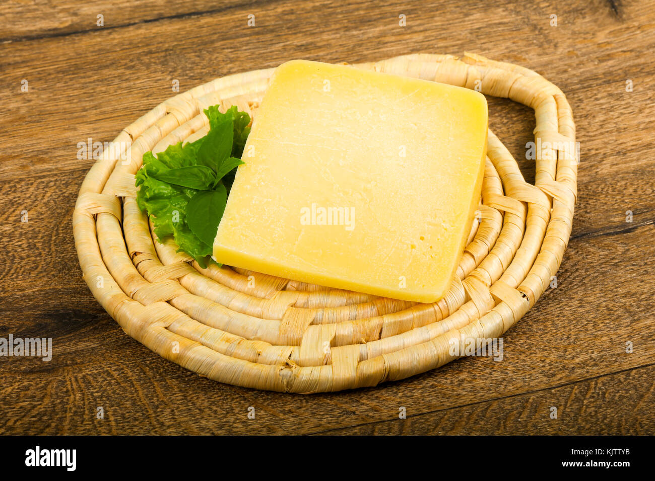 Parmesan cheese with salad leaves and basil Stock Photo Alamy