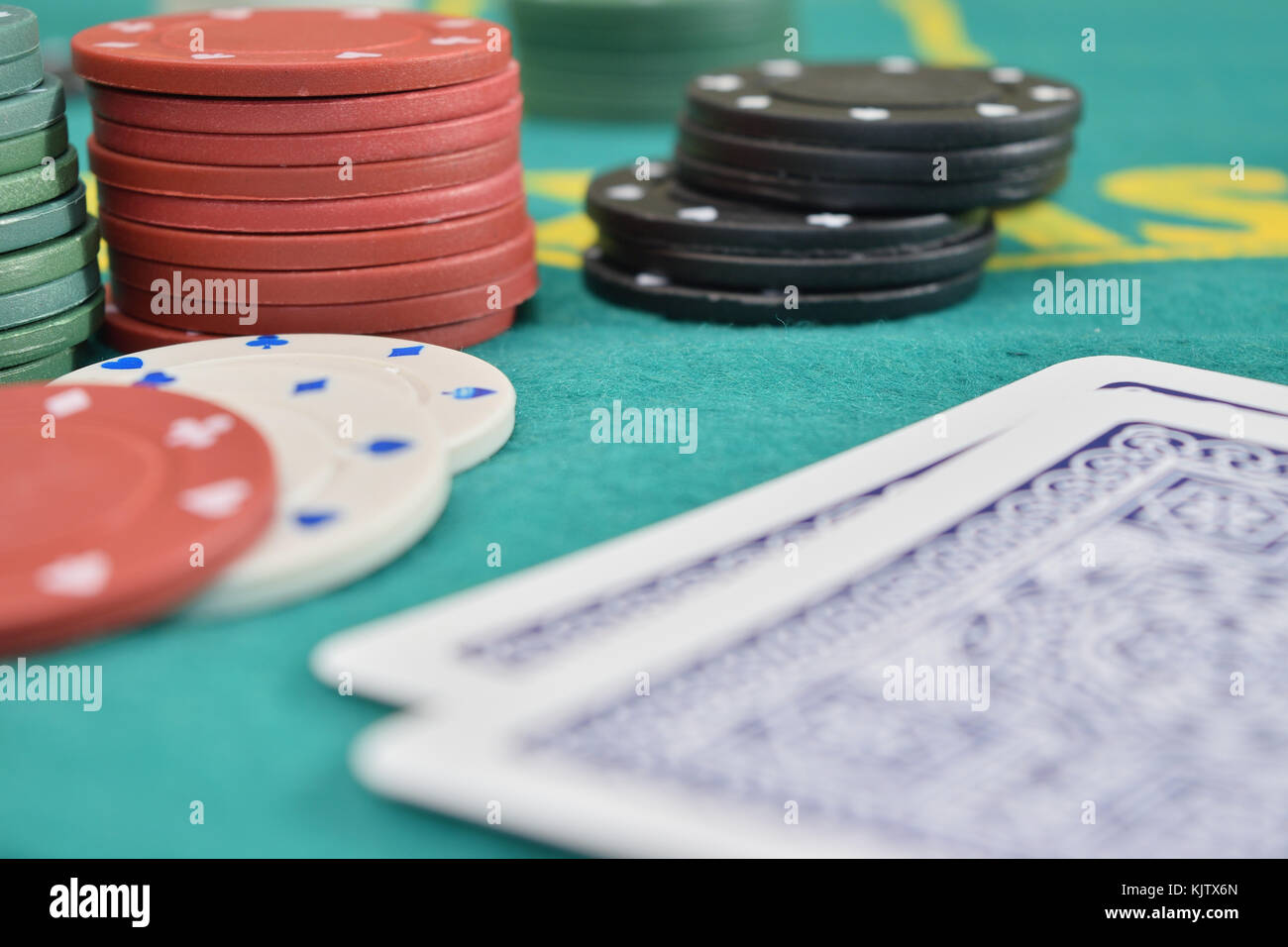 chips and cards on a gambling table with chips Stock Photo