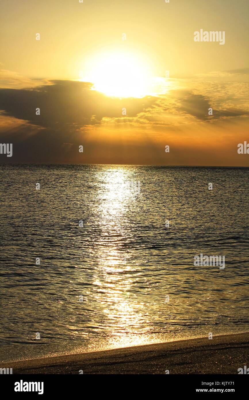Sunset on the beach Stock Photo - Alamy