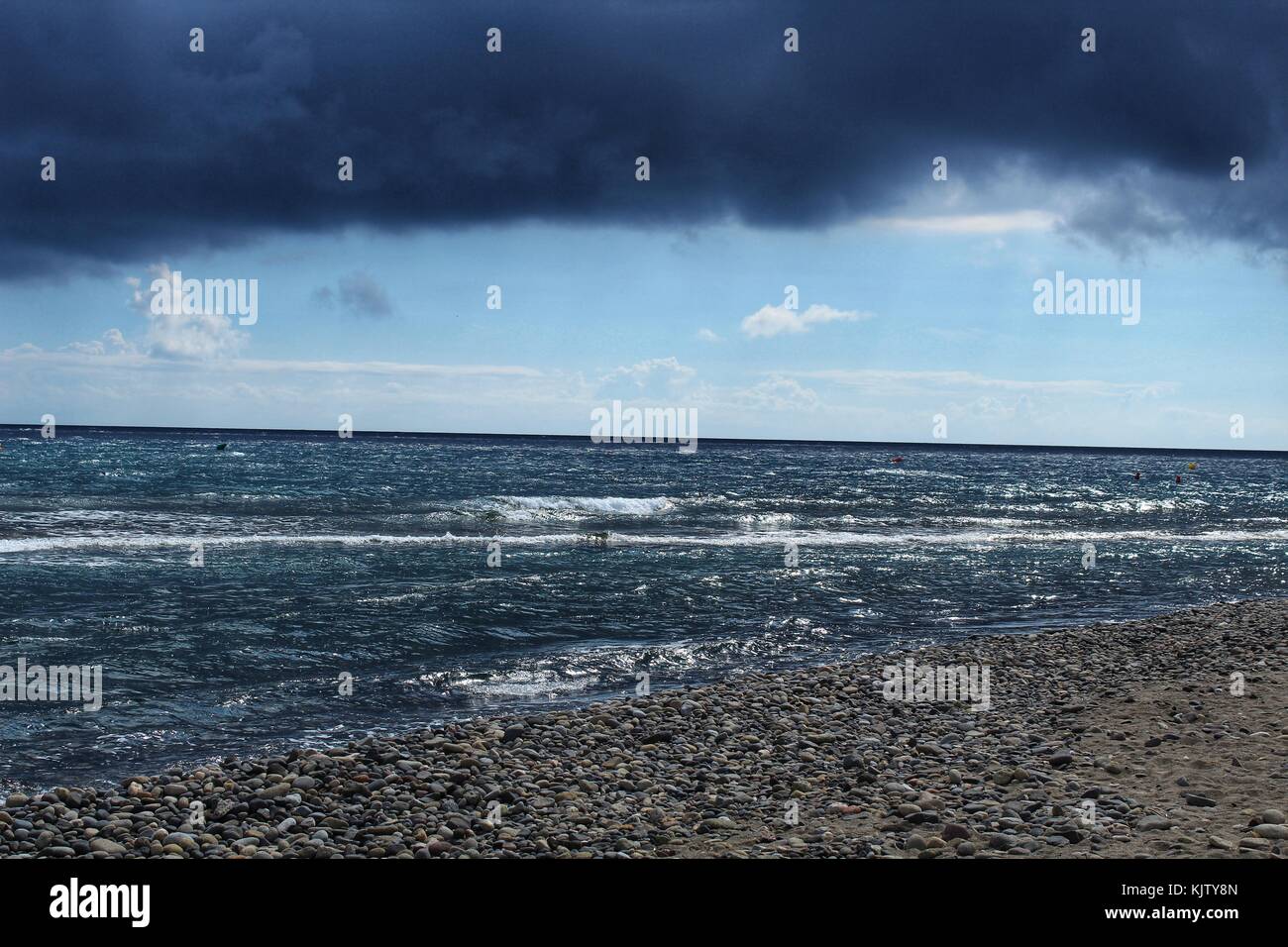 Beach under stormy sky Stock Photo - Alamy