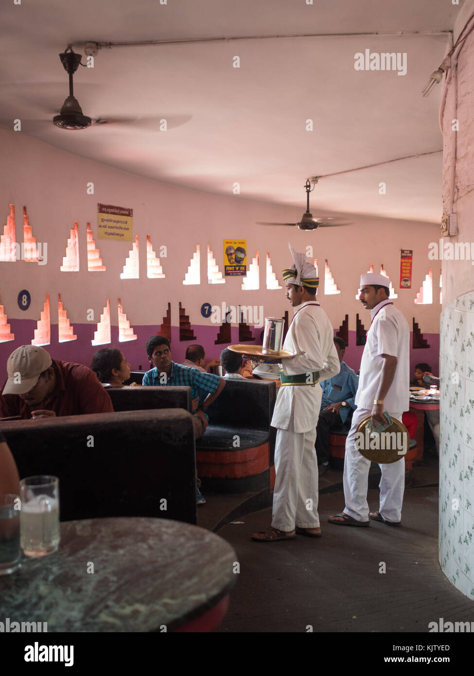 Waiters and clients inside the Indian coffee House in Trivandrum Stock