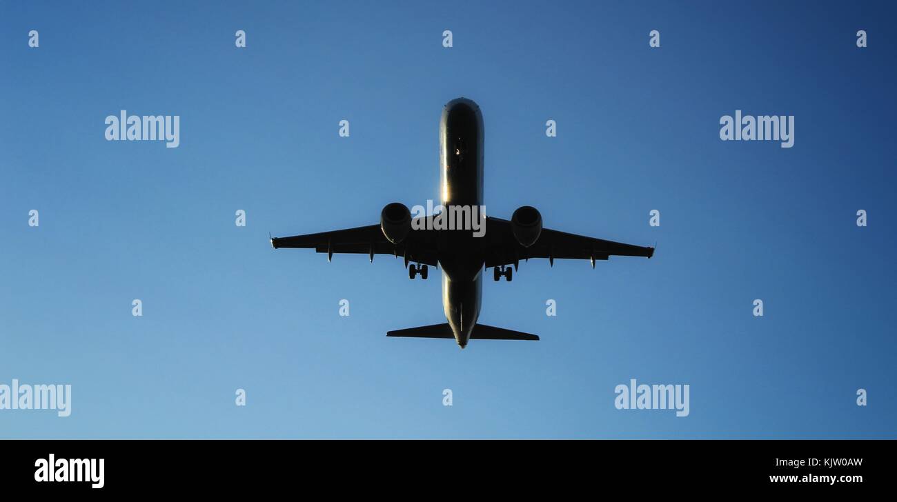 Plane furrowing the sky Stock Photo