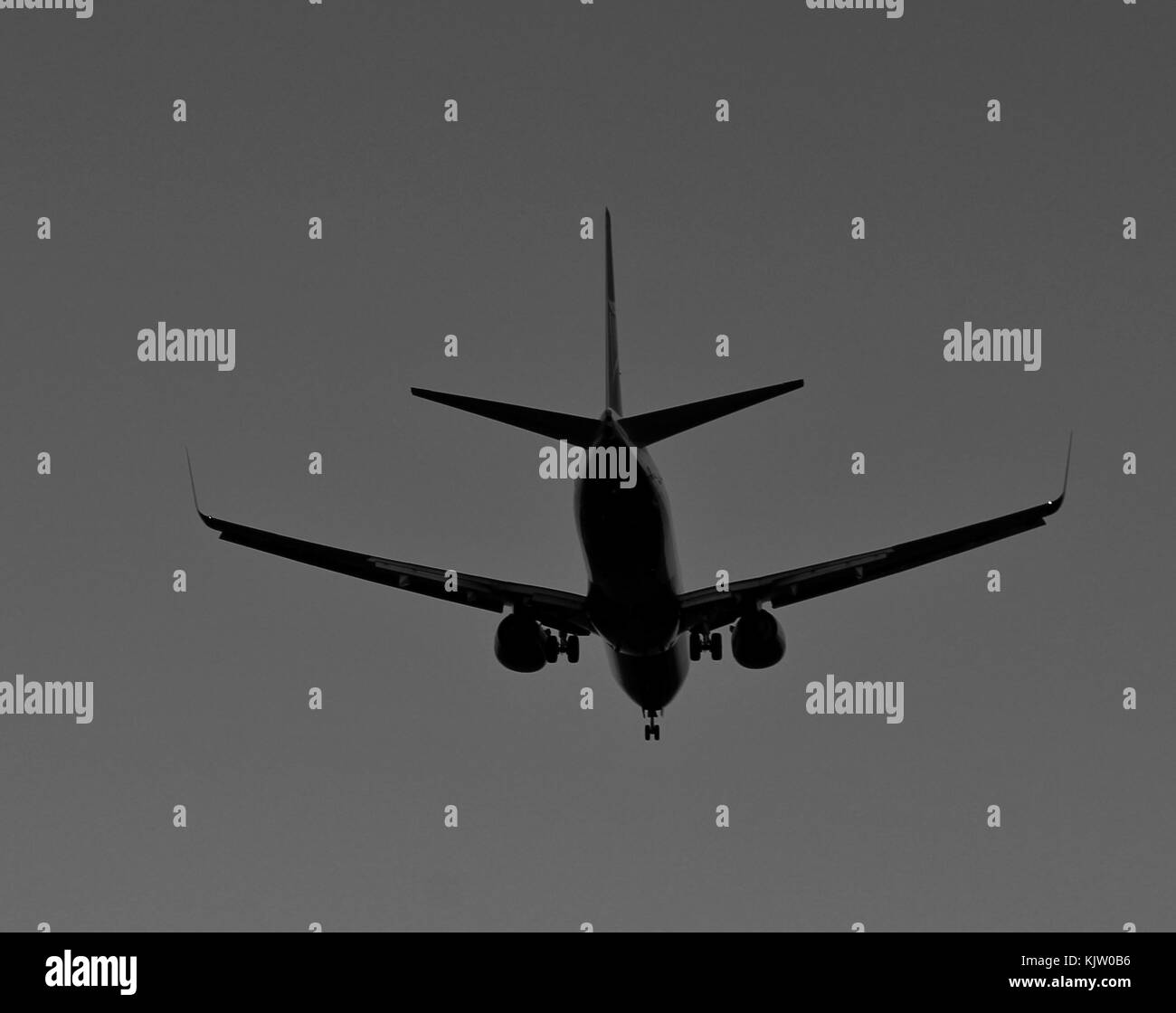 Plane furrowing the sky Stock Photo