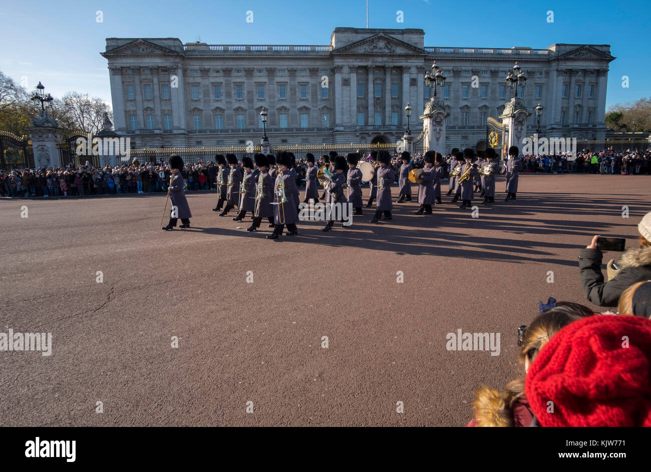 Buckingham Palace, London, UK. 26 November, 2017. In a historic first the Royal Navy form the Queen’s Guard at Buckingham Palace with musical support from Band of HM Royal Marines Scotland and Band of the Irish Guards, the first time in 357 years the ceremony has not been carried out by the Army‘s Household Division Foot Guards Regiments. Large crowds turn out on a cold and sunny winters day to watch the ceremony. Credit: Malcolm Park/Alamy Live News. Stock Photo