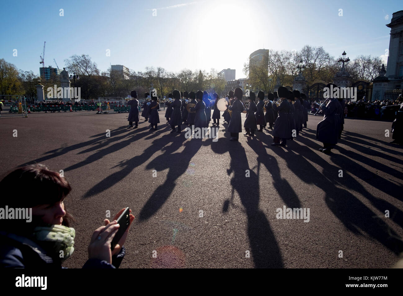 Buckingham Palace, London, UK. 26 November, 2017. In a historic first the Royal Navy form the Queen’s Guard at Buckingham Palace with musical support from Band of HM Royal Marines Scotland and Band of the Irish Guards, the first time in 357 years the ceremony has not been carried out by the Army‘s Household Division Foot Guards Regiments. Large crowds turn out on a cold and sunny winters day to watch the ceremony. Credit: Malcolm Park/Alamy Live News. Stock Photo