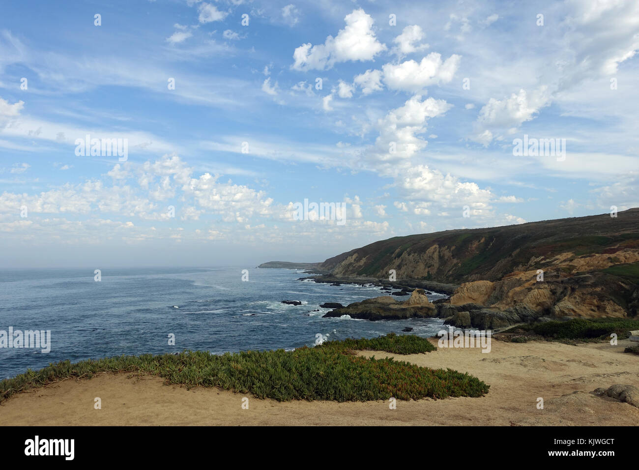 The pacific coast appears in front of the horizon at Bodega Bay in