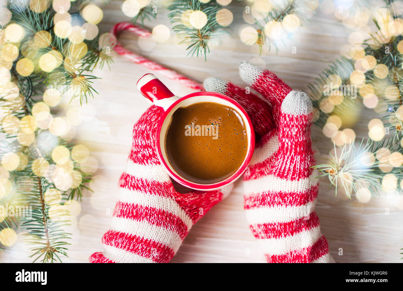 Hands in winter gloves holding a cup of coffee first person view Stock ...