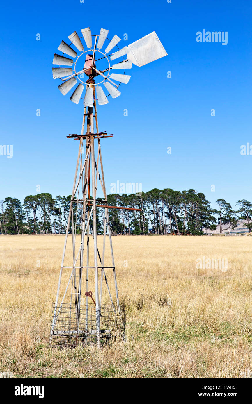 A windmill in a field Learmonth Victoria Australia.Learmonth is an outer suburb of Ballarat.View from Sunraysia Highway,B220 route. Stock Photo